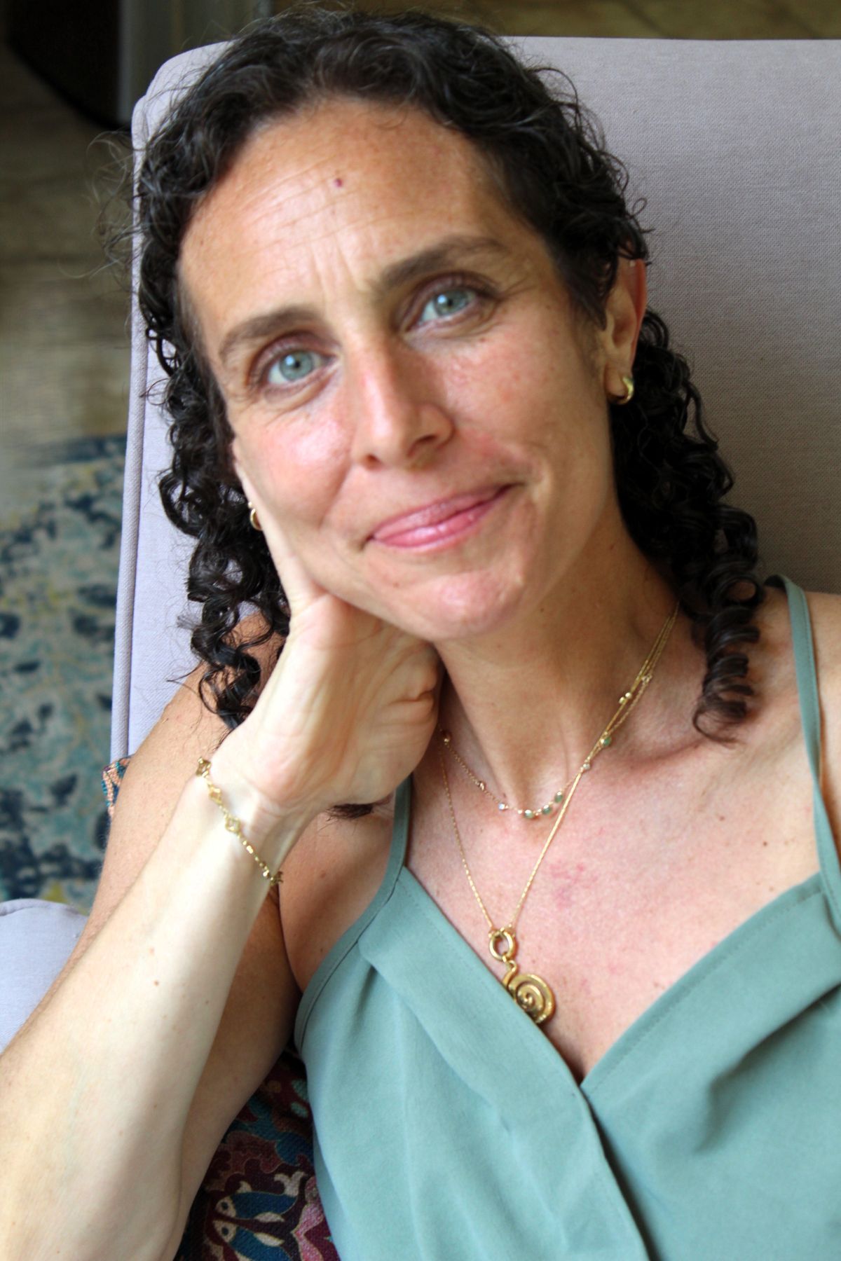 Lisa Marie Jacobson, LPC, seated outdoors
