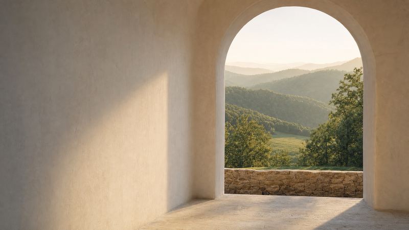 A calm arched room opening onto green woodland